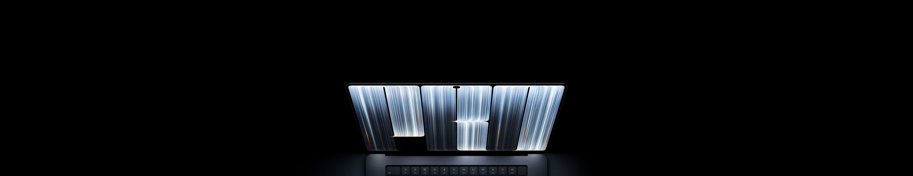 MacBook Pro with PROLED XDR Display, space black color, screen shows ribbonlike objects densely patterned with glowing stripes of various widths, spelling the word Pro.