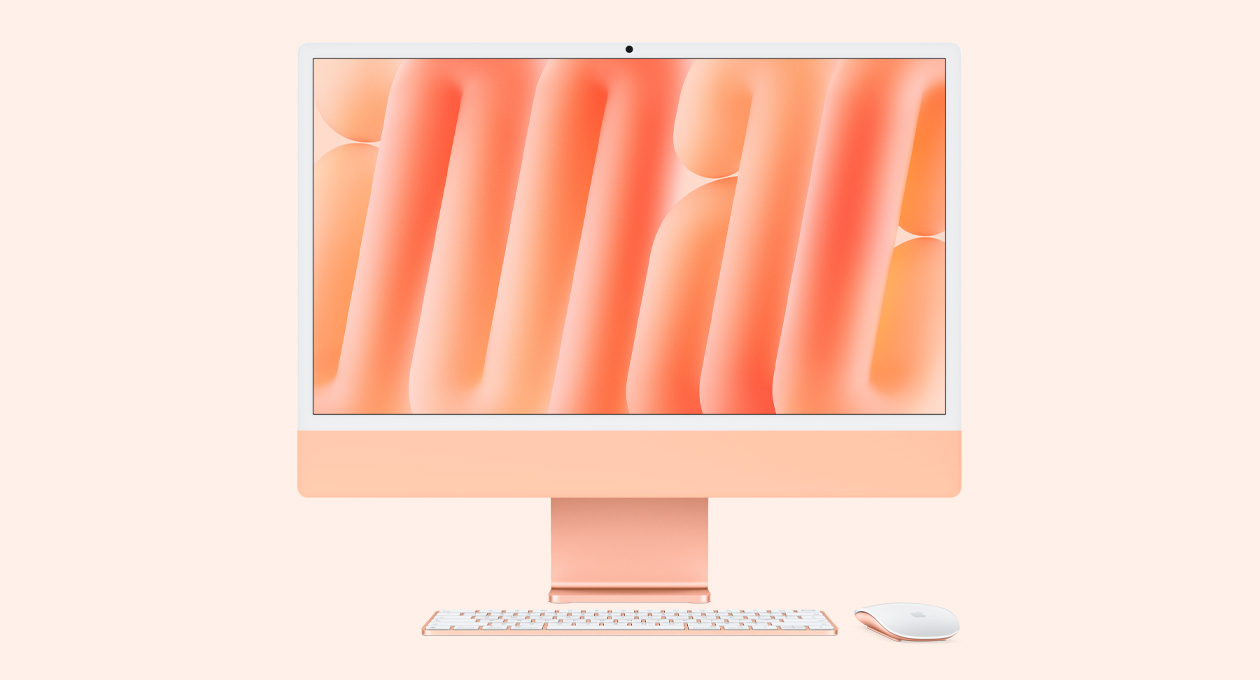 iMac, orange color, front exterior, with color-matched Magic Mouse and Magic Keyboard