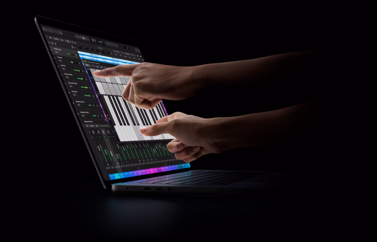 16-inch MacBook Pro with PROLED XDR Display, open lid, space black color, display shows a Logic Pro workflow as hands reach over the keyboard to interact with the tools via Touch